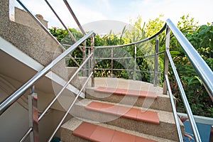 Stone staircase with stainless steel handrails