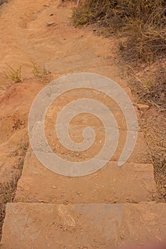 Stone stairs covered with dirt towards Punta Comet Mexico photo