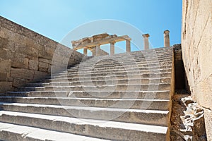 stone stairs leading to the colonnade in ancient Lindos, Rhodes, Greece