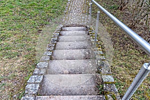 Stone stairs with a metal railing