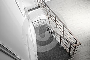 Stone stairs with metal railing indoors, view through CCTV