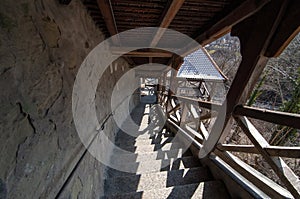 Stone stairs with wooden beams and roof