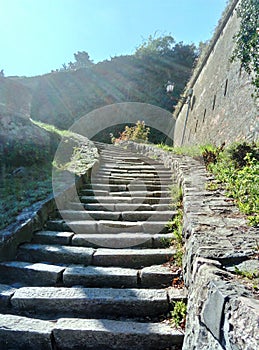 Stone stairway to heaven with sun rays