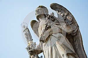 Stone statue of Angel Gabriel photo