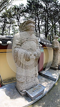 Stone statue of Buddha, deity, sacred animal and creature