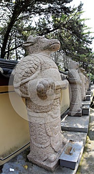 Stone statue of Buddha, deity, sacred animal and creature