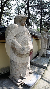 Stone statue of Buddha, deity, sacred animal and creature