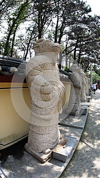 Stone statue of Buddha, deity, sacred animal and creature