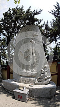 Stone statue of Buddha, deity, sacred animal and creature