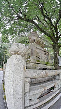 Stone statue of Buddha, deity, sacred animal and creature