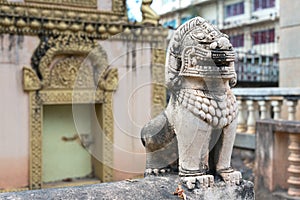 Stone statue of Buddhism animal deity lion or dragon in Siem Reap temple, Cambodia