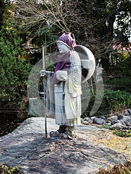 Stone statue of a Buddhist pilgrim in Japan