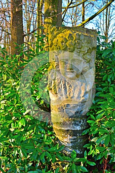 Stone statue of a face of a child