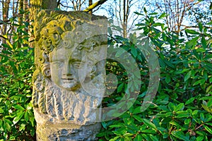 Stone statue of a face of a child
