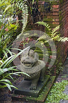 A stone statue in the Fort Canning park, in Singapore