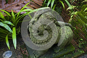 A stone statue in the Fort Canning park, in Singapore