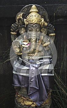 Stone Statue Of Ganesha With Golden Ornament