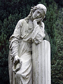 Stone Statue Grieving Woman photo