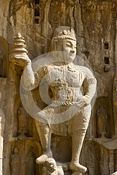 Stone statue of a heavenly king in the Longmen Gro