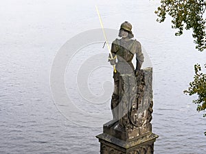 Stone statue of a knight near the charles bridge in prague