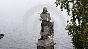 stone statue of a knight near the charles bridge in prague