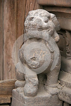stone statue of a lion in a buddhist monastery (shuanglin) closed to pingyao (china)