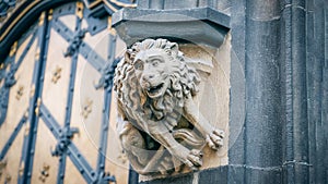 Stone statue lion at the facade of New City Hall in Munich, Germany. Details, panorama