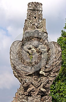 Stone statue - Vishnu seated on Garuda