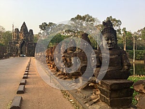 Stone statues. South Gate, Angkor .Cambodia .