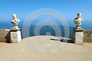 Stone statues on sunny Terrace of Infinity in Villa Cimbrone above the sea in Ravello, Amalfi Coast, Italy.