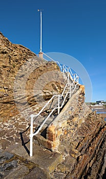 Stone steps lead up to a lookout point on the breakwater, Bude, Cornwall.