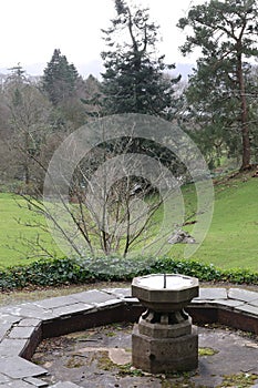 Stone Stone Fountain at Holehird Gardens near Windermere, Lake District, Cumbria, England, UK