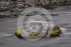 Stone streamlined water in the river.