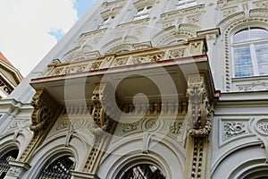 Stone and stucco Neo-Renaissance balcony and facade in old downtown in Europe