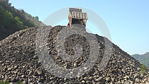 Stone stuck in dump truck unloading