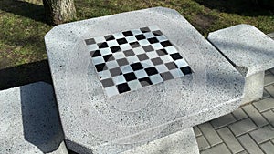 Stone table and chairs with chess board in park outdoor