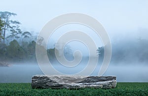 Stone tabletop podium floor outdoors misty lake and forest in winter nature landscape background.cosmetic natural product present
