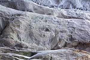 Stone texture in snow and ice. Mountain wall. Rock texture.