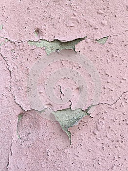 Stone surface covered with peeling paint. Abstract wallpaper. Minimalism.