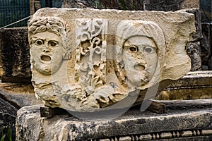 Stone Theater masks in Myra Ancient City. Demre, Antalya, Turkey