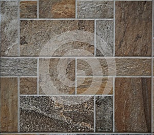 Stone tile rustic floor. The tiles are made of polished rocks of different types,colors and shapes .