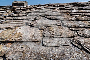 The stone tiles roof of an ancient house in the beautifully preserved medieval village Carmine Superiore. Cannobio. Italy