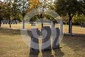 Stone tombstones in the German cemetery in the fall. Beautiful German cemetery near Kyiv. Many dead German soldiers of the dead