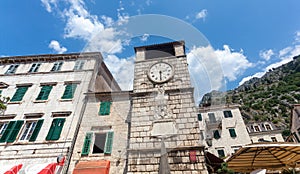 Stone tower clock in city of Kotor, Montenegro