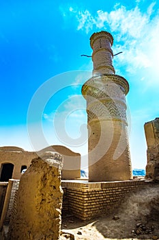 Stone tower in ghost town of Kharanaq in Iran photo