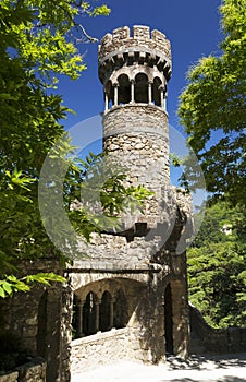 Stone tower of the Guardians portal - one of the entrances to the Initiation well of Quinta da Regaleira in Sintra, Portugal.