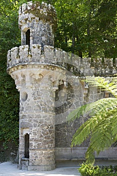 Stone tower of the Guardians portal - one of the entrances to the Initiation well of Quinta da Regaleira in Sintra, Portugal.