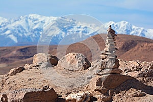 Stone tower on the top of hill in Ajt Bin Haddu, with a view of atlas mountains in the background
