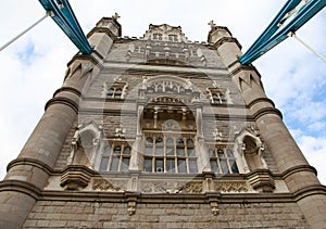 A stone tower and windows of Tower Bridge London