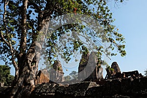 Stone towers of a medieval Khmer temple. Baray east Mebon